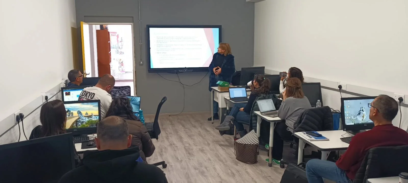 Teachers participating in a computer lab training session